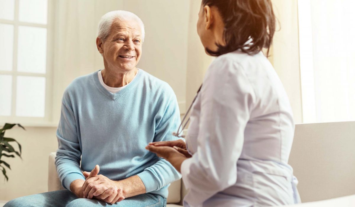 Patient talking with medical practitioner